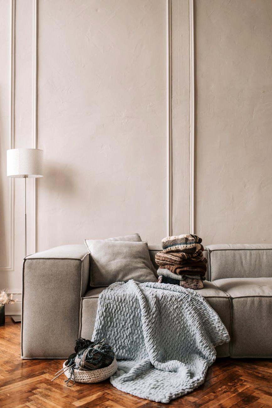 Luxurious knitted throw draped over a cozy sofa