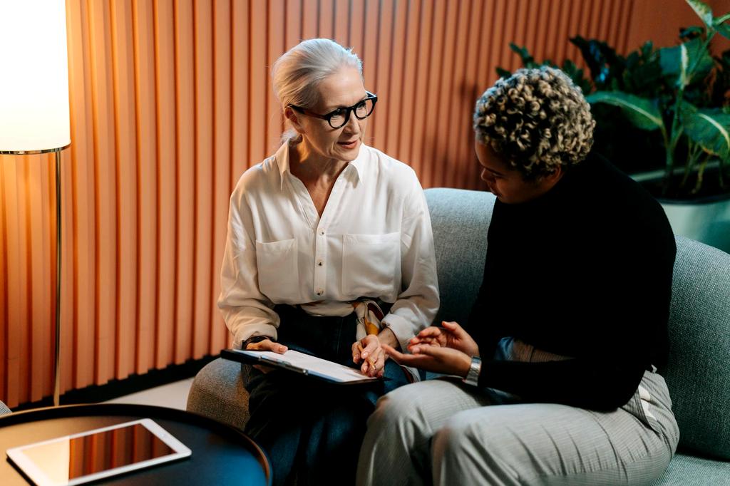 Artisan offering consultation with knitting design plans