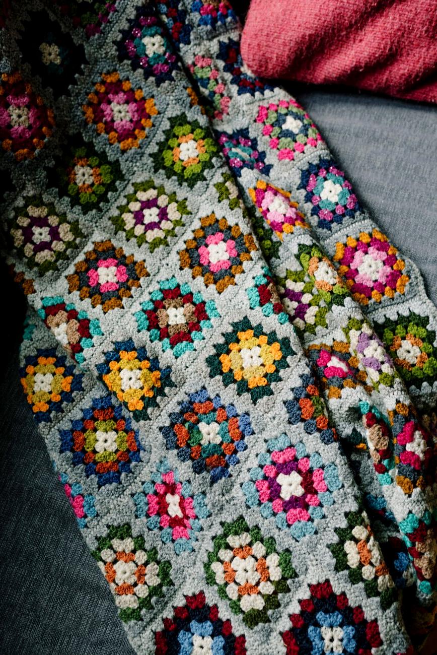 Michael Chen interior designer with knitted home decor