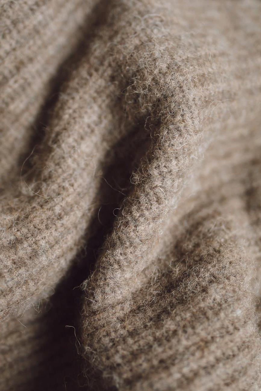 Sarah Johnson smiling in her cozy living room