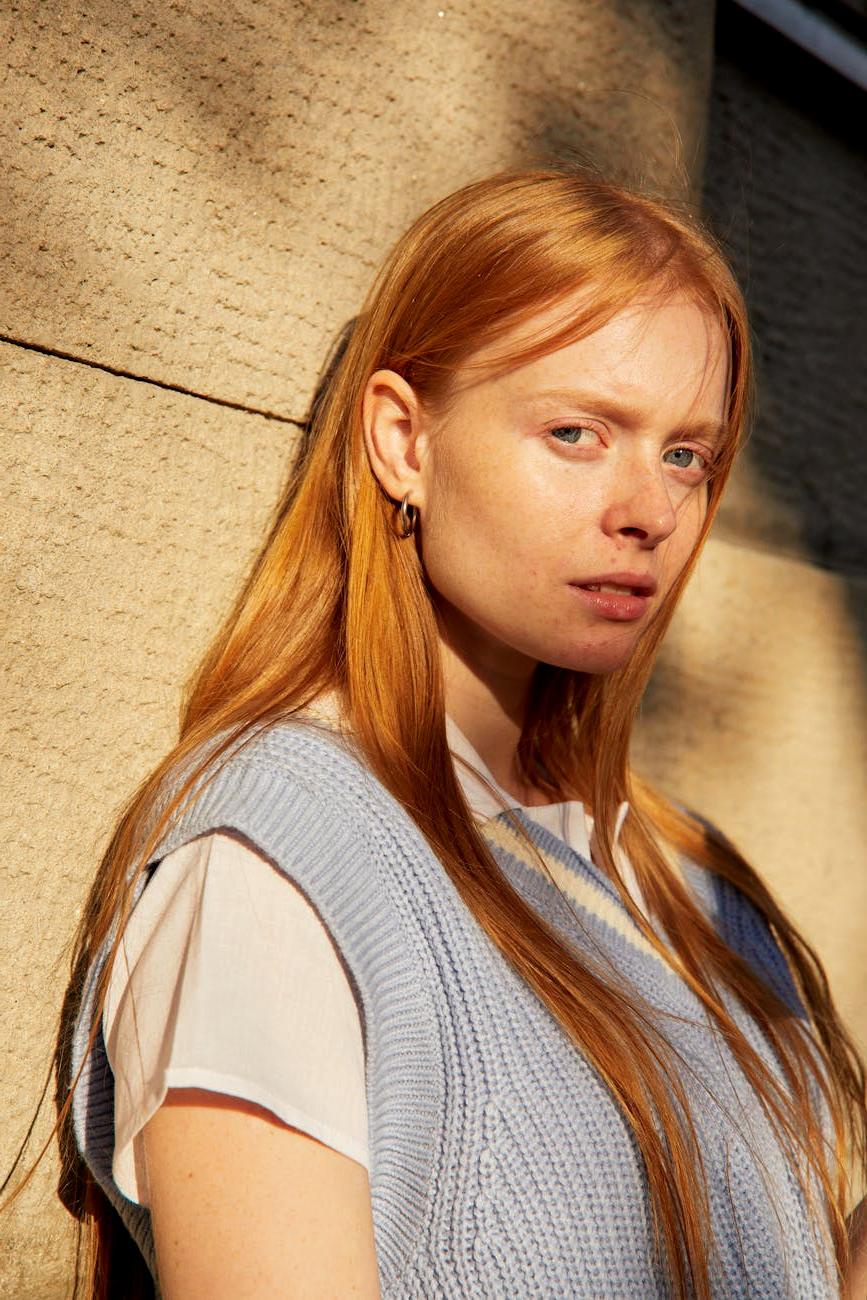 Elegant knitted wall hanging with geometric shapes and natural tones