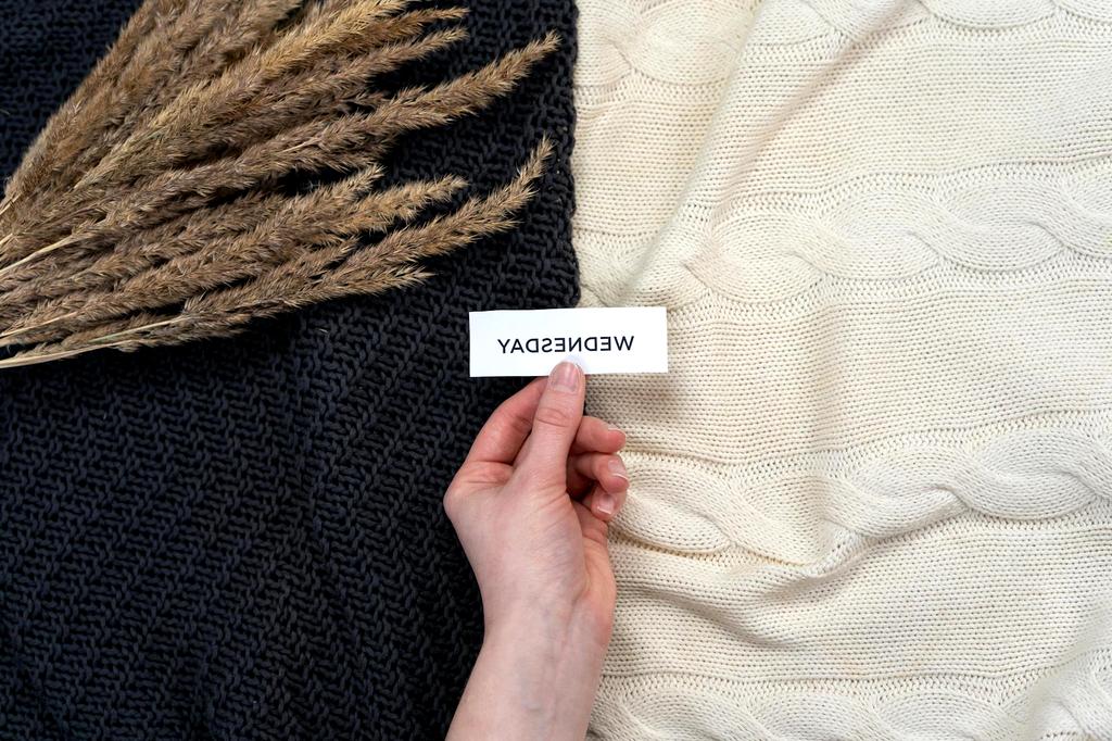 Luxurious cable-knit throws and blankets in natural wool tones